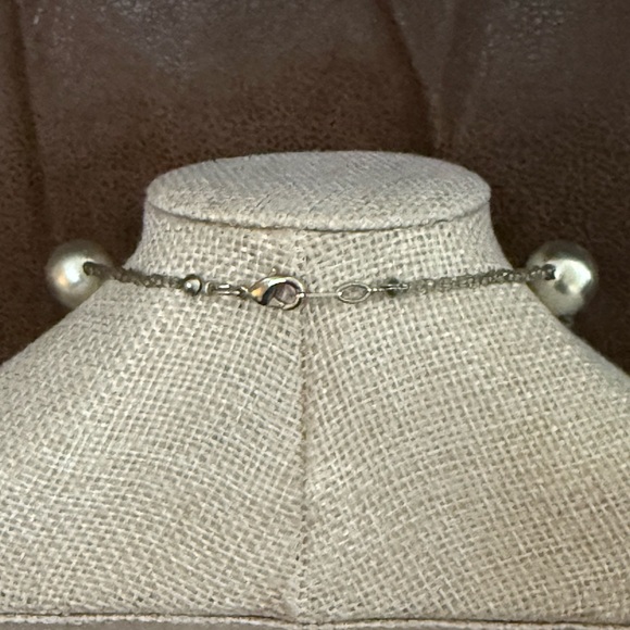 Featuring large silver faux pearls & silver shaped beads on thin wire or cord. - Picture 3 of 6